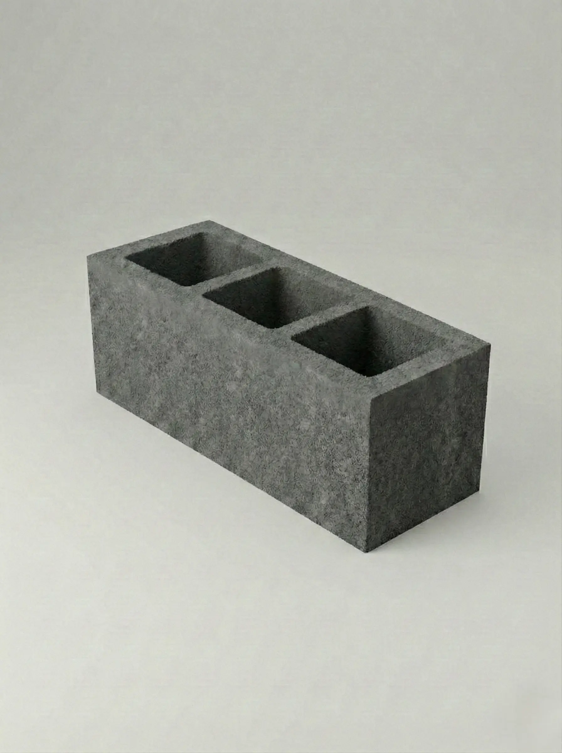 Bloczki betonowe trójkomorowe na białym tle, bez dodatkowych elementów